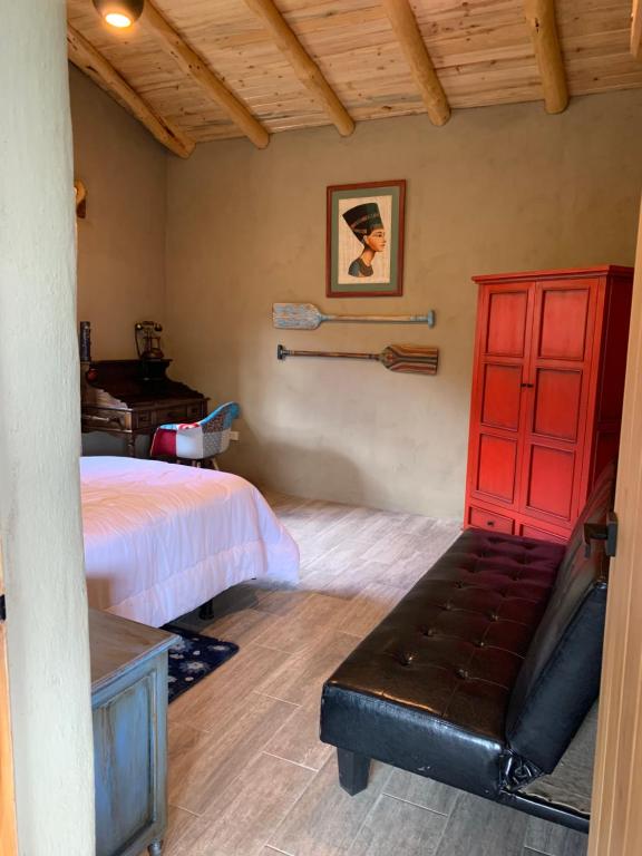 Un pat sau paturi într-o cameră la Cabaña La Guaranga