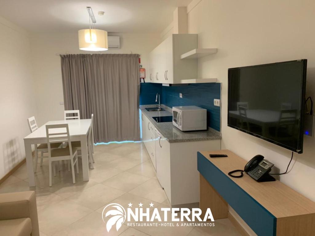 Kuchyň nebo kuchyňský kout v ubytování ApartHotel NhaTerra