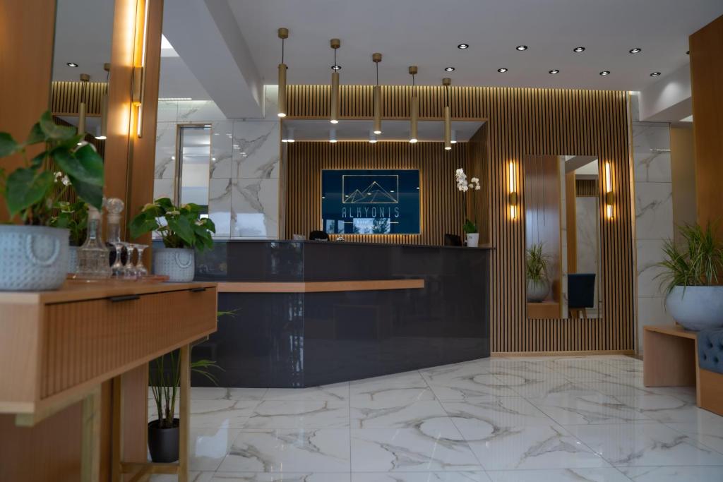 a lobby of a hotel with a reception desk at Alkyonis Hotel & Spa in Kato Loutraki