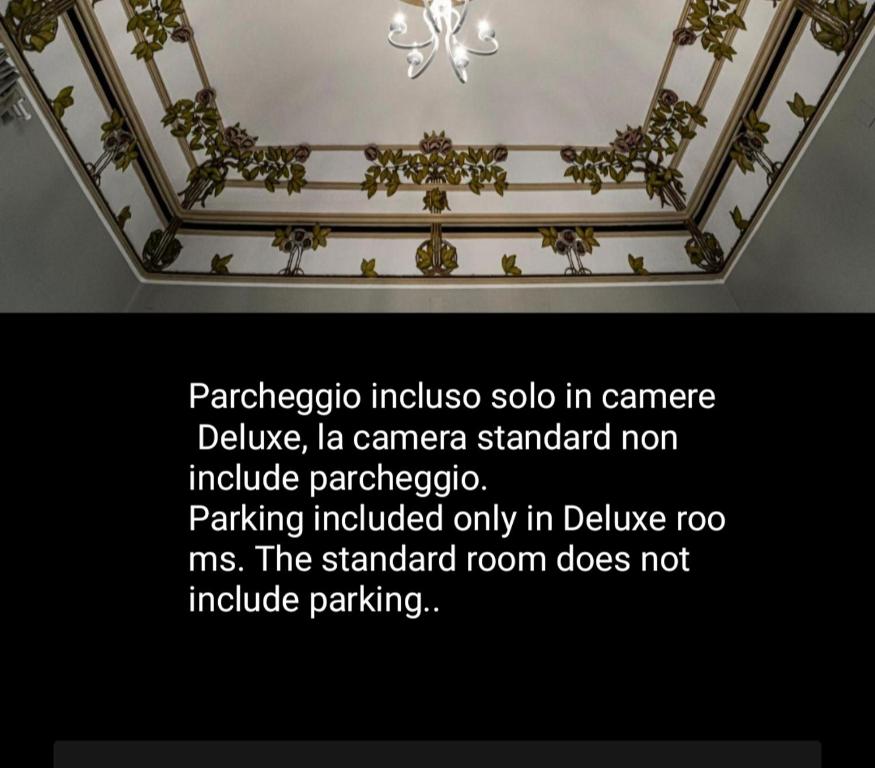 a picture of a ceiling with a sign on it at Gli specchi di Archimede in Siracusa