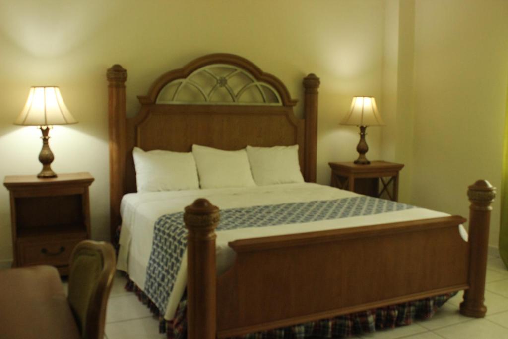 Postel nebo postele na pokoji v ubytování Hotel Carnaval