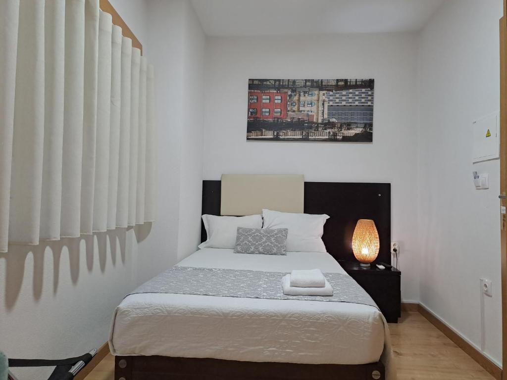 Ein Bett oder Betten in einem Zimmer der Unterkunft Hotel SQUARE