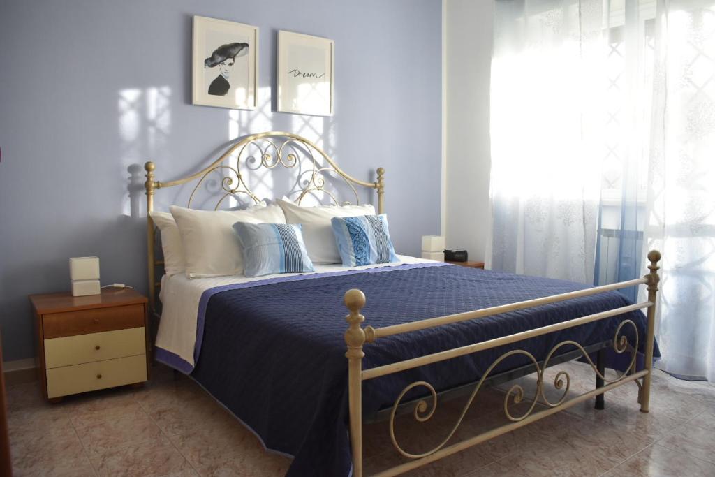 Кровать или кровати в номере La casa di Mimmo