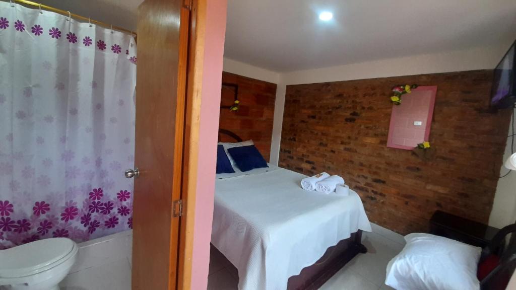 Postel nebo postele na pokoji v ubytování Hospedaje Maria Valentina