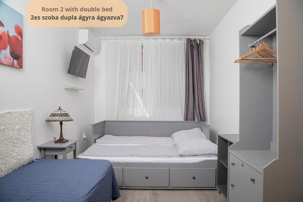 Postel nebo postele na pokoji v ubytování Tulip Home Guest House