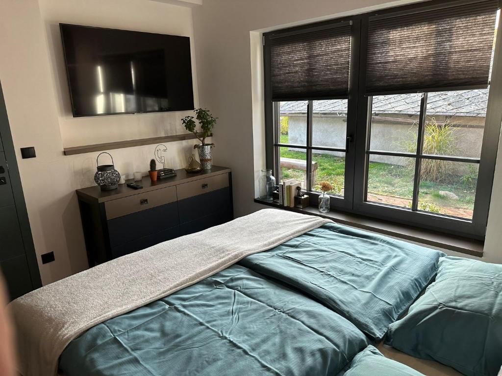 Postel nebo postele na pokoji v ubytování Design apartmán v zahradě