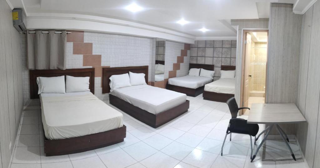 Postel nebo postele na pokoji v ubytování HOTEL SAN THOMAS INN