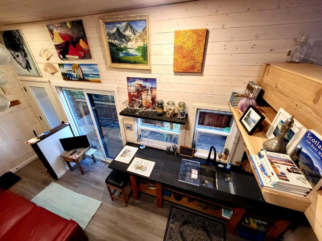 an overhead view of a room with a desk in a house at Cliffside Hideaways 