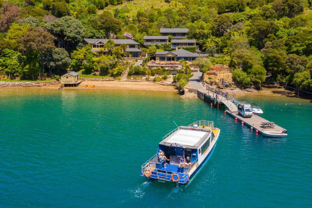 a boat is docked at a dock in the water at Lochmara Lodge in Lochmara Bay