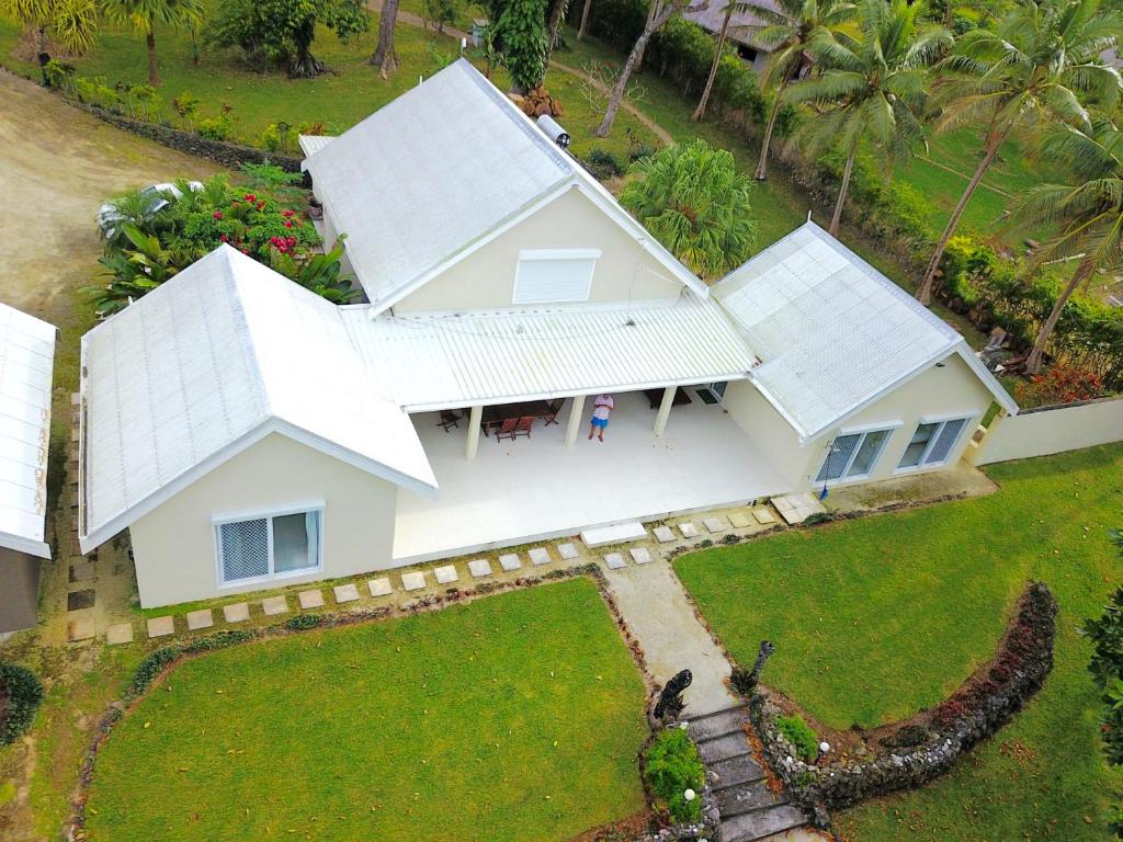 an aerial view of a white house at Vila Del Mare Beachfront Resort in Port Vila