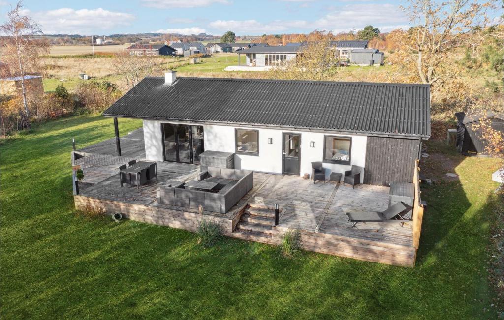 an overhead view of a house with a deck at Nice Home In Sams With Wi-fi in Nordby