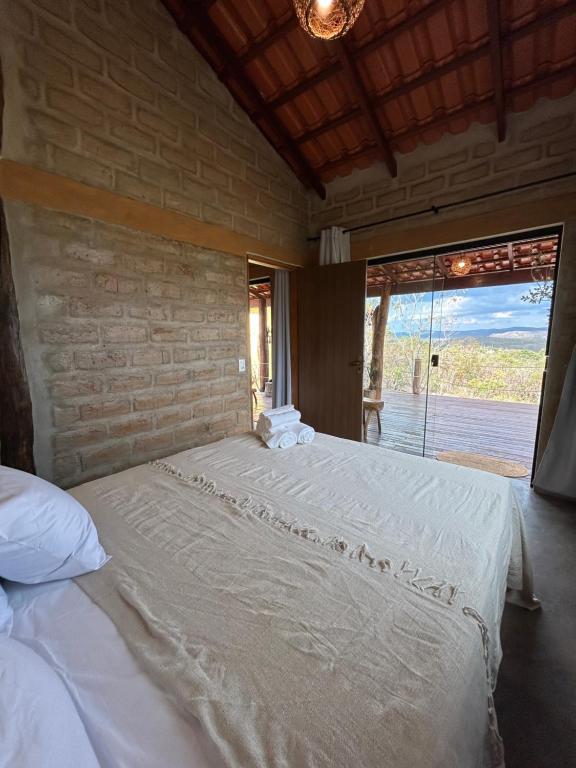Postel nebo postele na pokoji v ubytování Chalé Pousada Maná do Céu - São Jorge