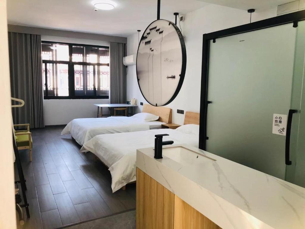 Postel nebo postele na pokoji v ubytování Hetao B&B