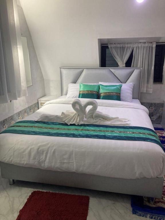 Voodi või voodid majutusasutuse วิวธารารีสอร์ท (ViewThara Resort) toas