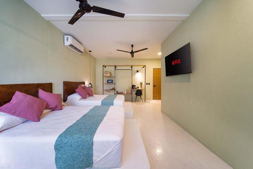 Postel nebo postele na pokoji v ubytování Hotel Bindani’