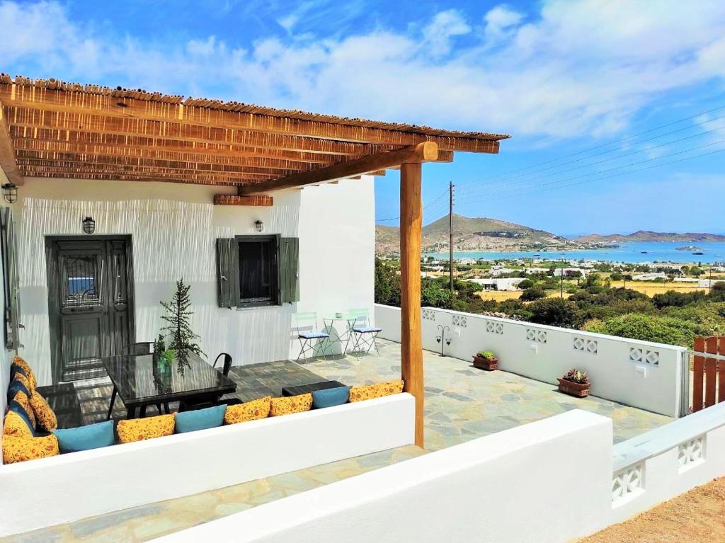 a view of the ocean from the balcony of a house at The old barn, Naousa Paros in Naousa