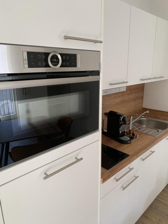 Kuchyň nebo kuchyňský kout v ubytování Apartment Metzingen Outlet City Business Zentral Modern