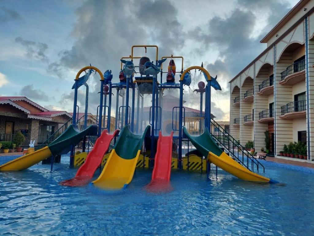 a water slide in a swimming pool at Grand Beach Resort in Mandarmoni