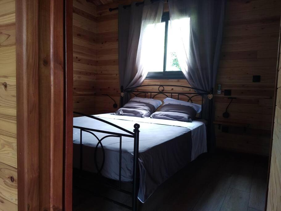 Postel nebo postele na pokoji v ubytování Ti Natte