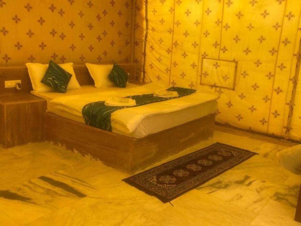 a bedroom with a bed in a room at The Taj of Desert in Sām