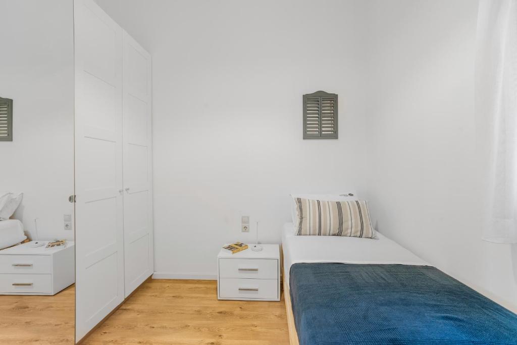 Łóżko lub łóżka w pokoju w obiekcie Alfresco Villas