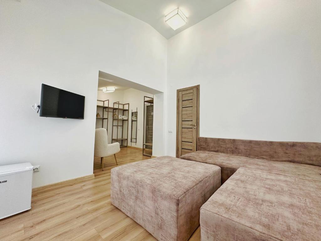 TV a/nebo společenská místnost v ubytování Higina Spa Hotel