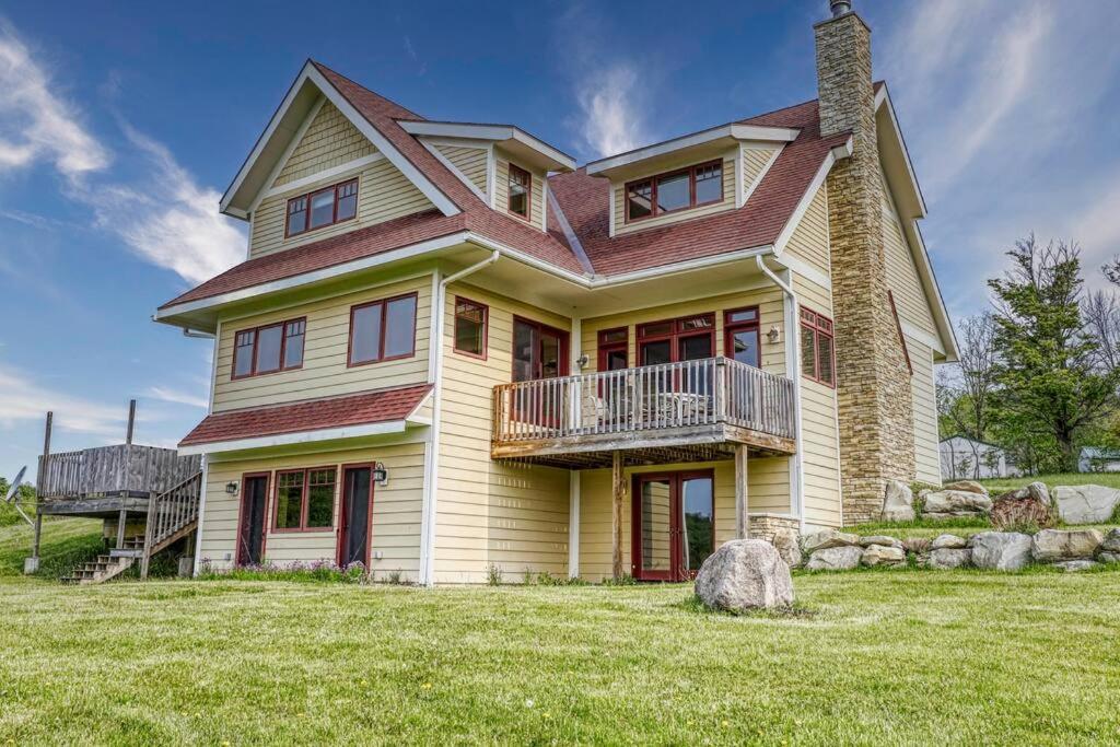 a large house on a grassy field at Huge Home w Studio Apt-Mountain Views-Hot Tub-Sauna in Ellicottville