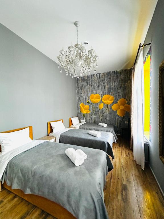 Postel nebo postele na pokoji v ubytování Hotel Zerta Old Tbilisi