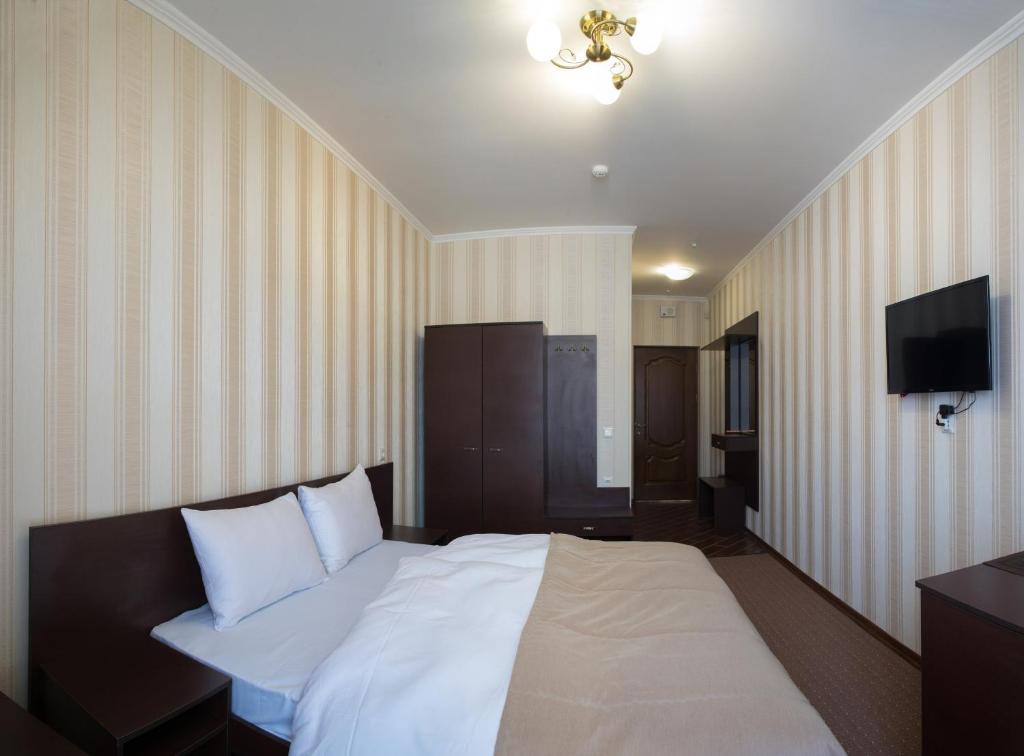 Postel nebo postele na pokoji v ubytování Kasimir Resort Hotel & SPA