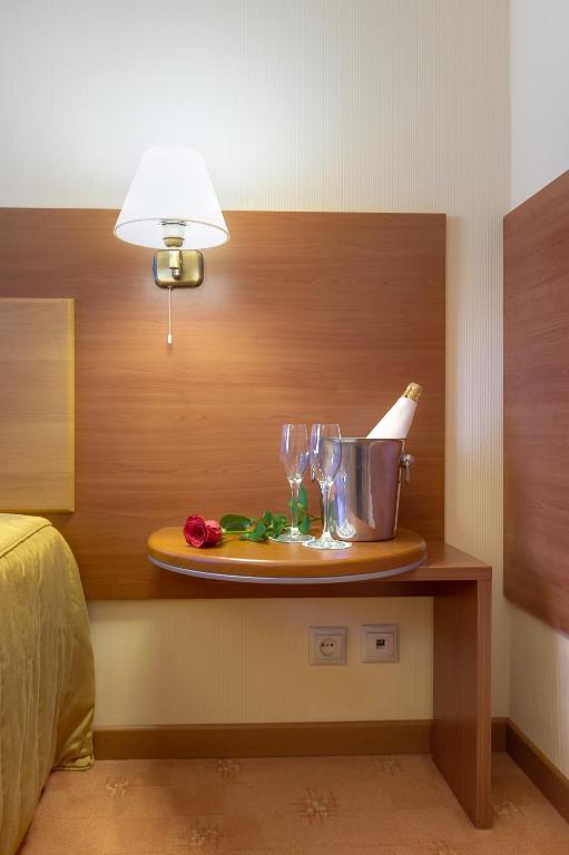 Postel nebo postele na pokoji v ubytování Hotel Palas