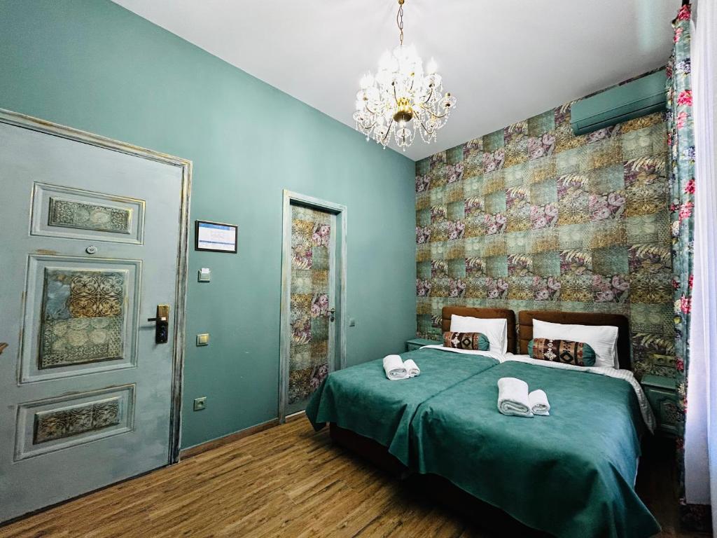 Postel nebo postele na pokoji v ubytování Hotel Zerta Old Tbilisi