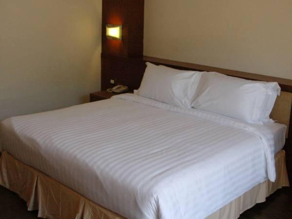Postel nebo postele na pokoji v ubytování Hiran Residence