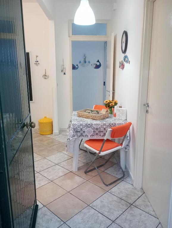 a dining room with a table and a chair at Matteo's House Taormina in Taormina
