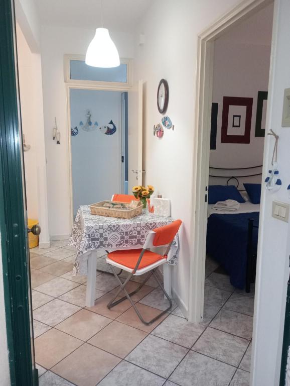 a room with a table and a chair and a bed at Matteo's House Taormina in Taormina
