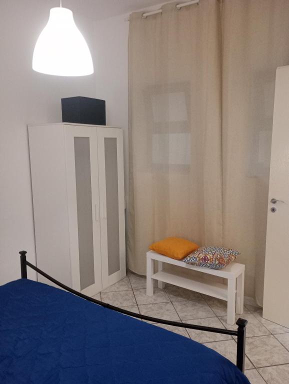 a bedroom with a bed and a bench and a lamp at Matteo's House Taormina in Taormina