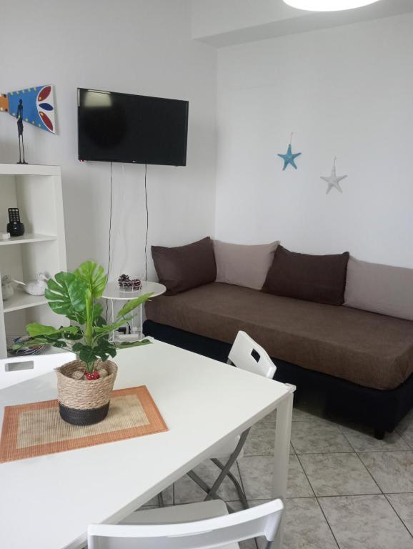 a living room with a couch and a table at Matteo's House Taormina in Taormina