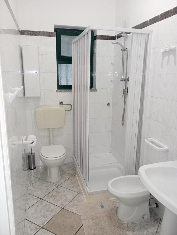 a bathroom with a shower and a toilet and a sink at Matteo's House Taormina in Taormina