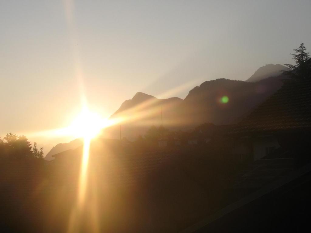 The sunrise or sunset as seen from a panziókat or nearby