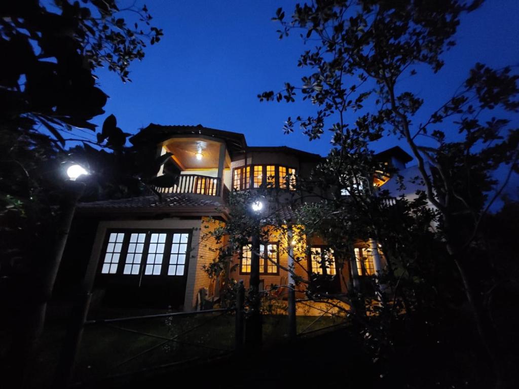 a house at night with its lights on at Mystique Hideout in Kandy