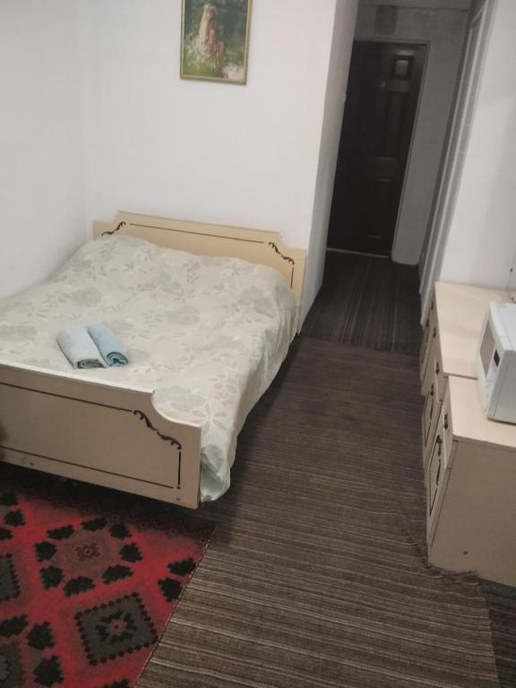 Postel nebo postele na pokoji v ubytování Andreevskiy mini-hotel