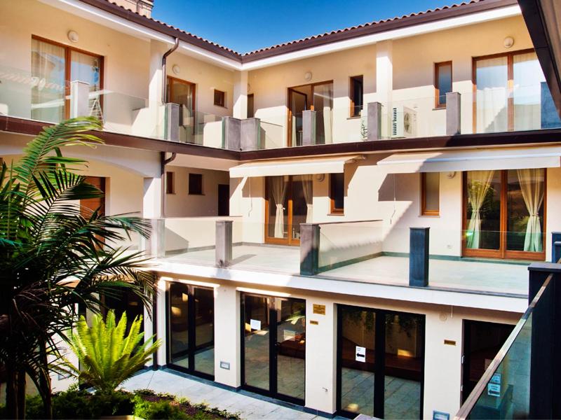 a large building with balconies on the side of it at Studio Apartment in Catania