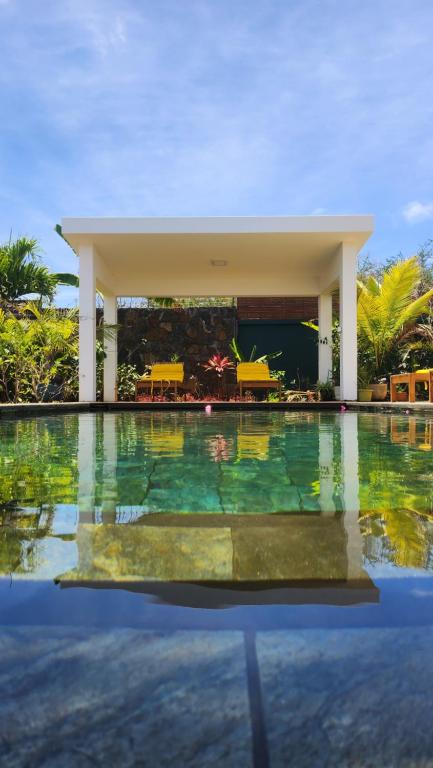 a swimming pool at a resort with a swimming pool at Villa O' in Cap Malheureux