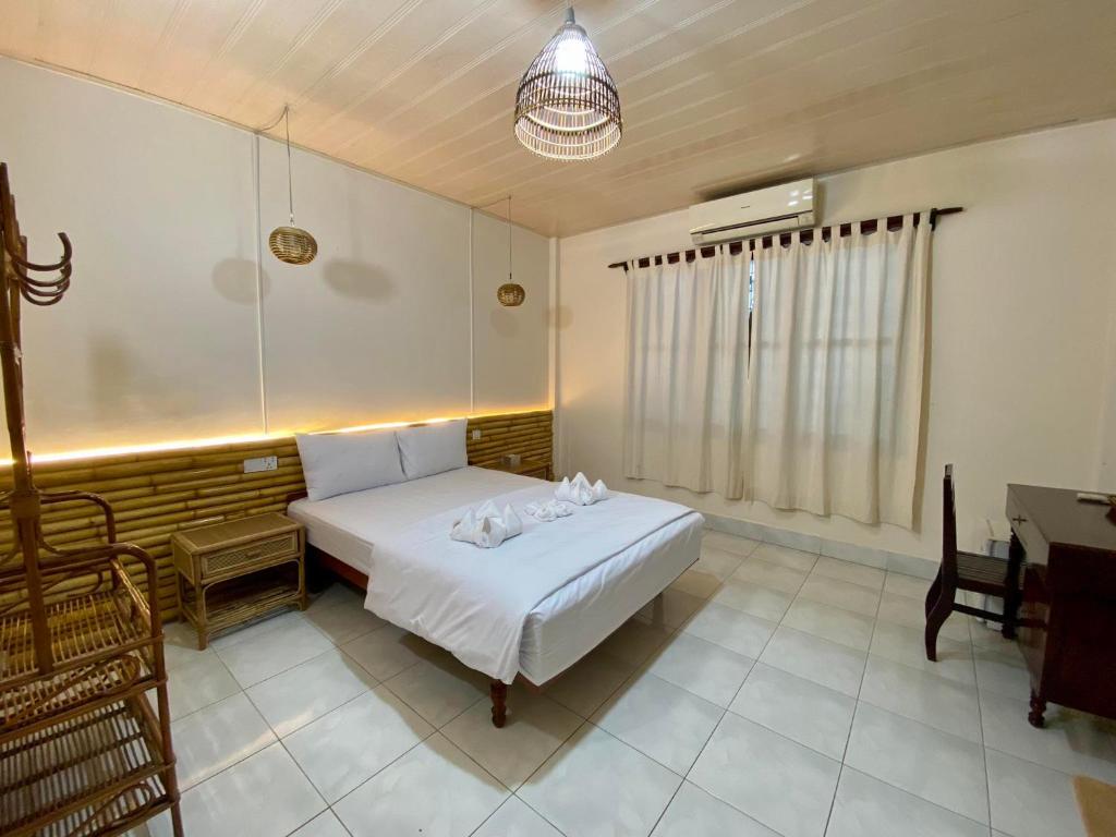 Postel nebo postele na pokoji v ubytování Ecran Riverfront Guesthouse