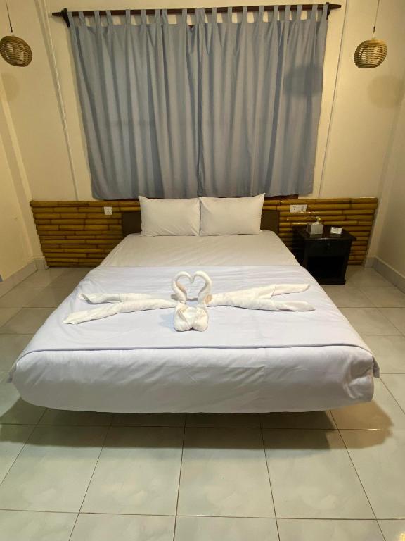 Postel nebo postele na pokoji v ubytování Ecran Riverfront Guesthouse