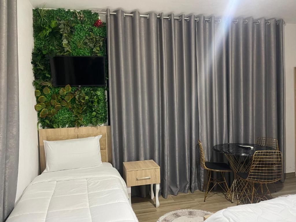 Postel nebo postele na pokoji v ubytování four generation hotel