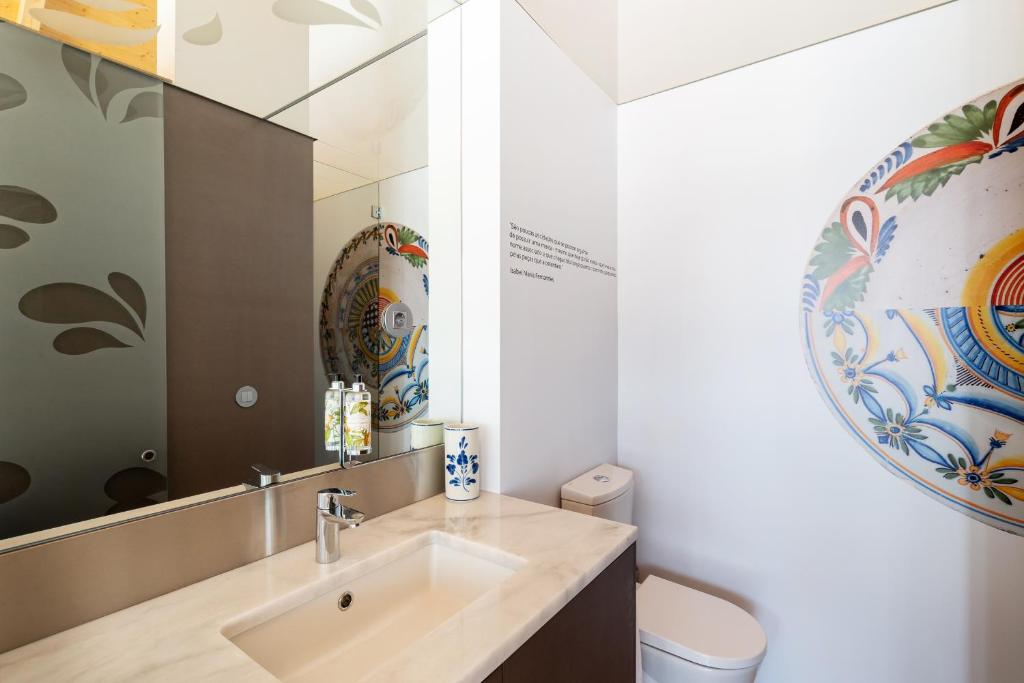 Een badkamer bij Pensao O Laranjeira