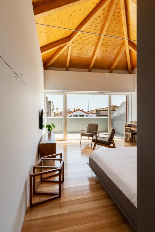 Een bed of bedden in een kamer bij Pensao O Laranjeira