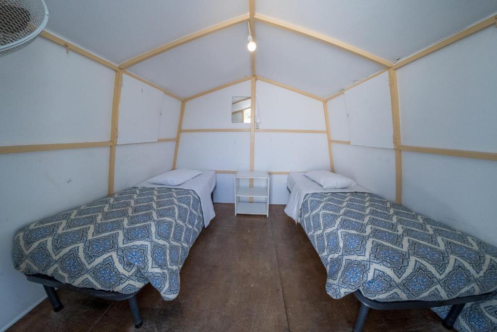 Postel nebo postele na pokoji v ubytování Paradise Beach Camping