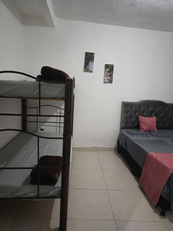 Postel nebo postele na pokoji v ubytování Hotel Policarpa