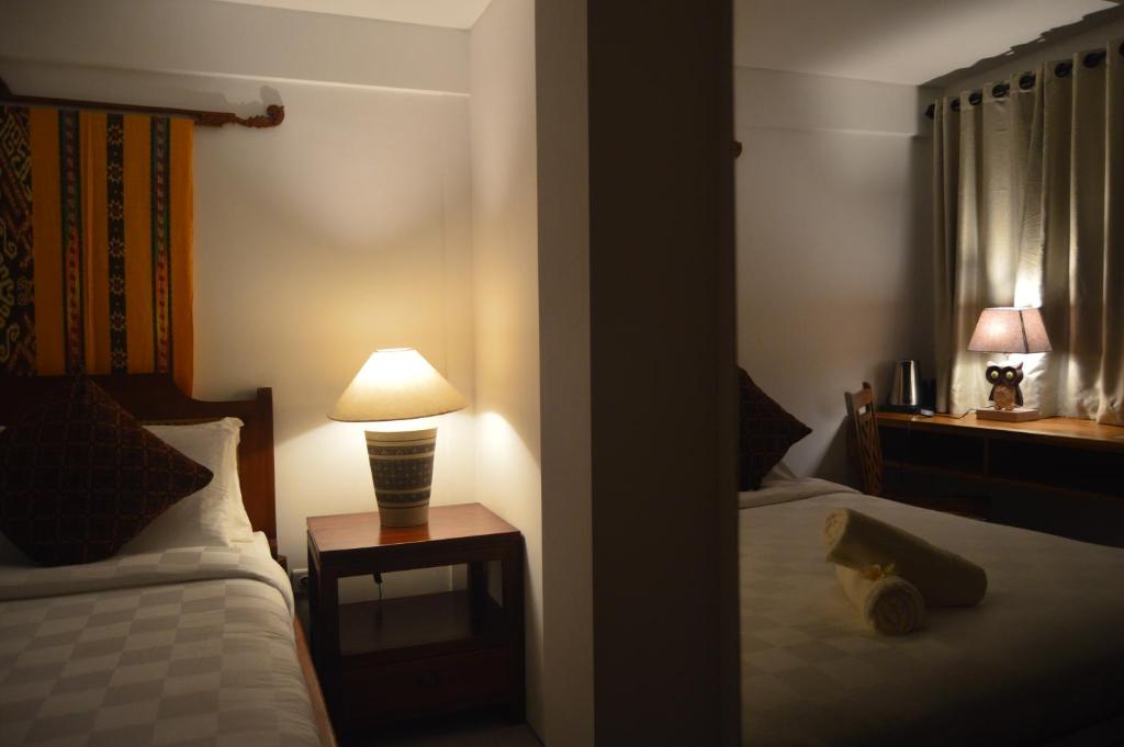 Postel nebo postele na pokoji v ubytování Serenity Private Villa Mas Ubud